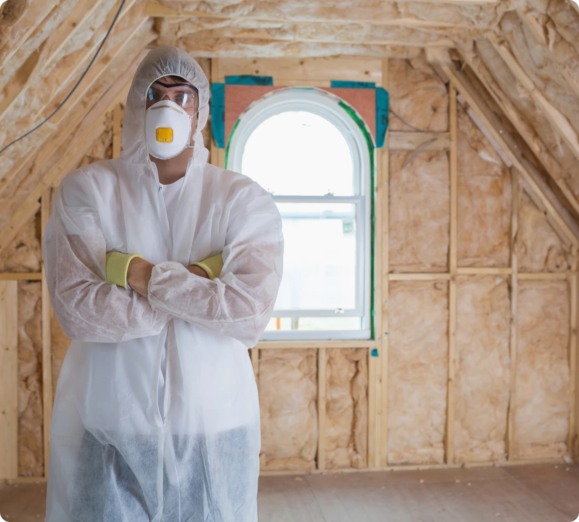 Worker with mask, standing indoors
