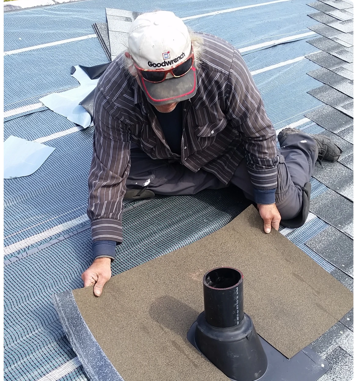 Worker fitting roofing sheet