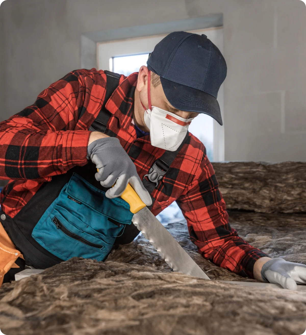 Construction worker installing insulation