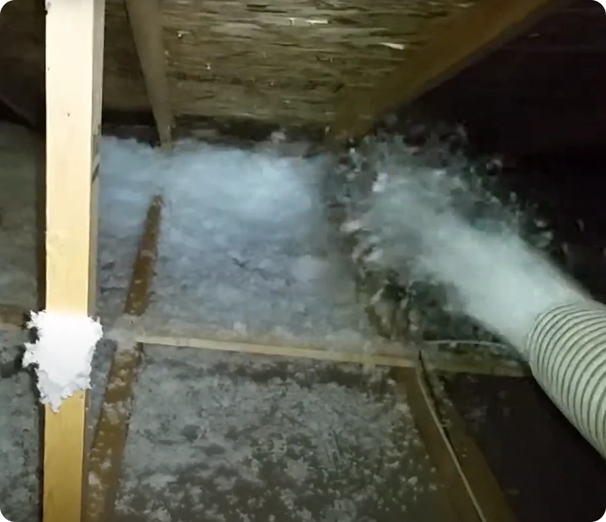 Blown-in insulation filling attic floor